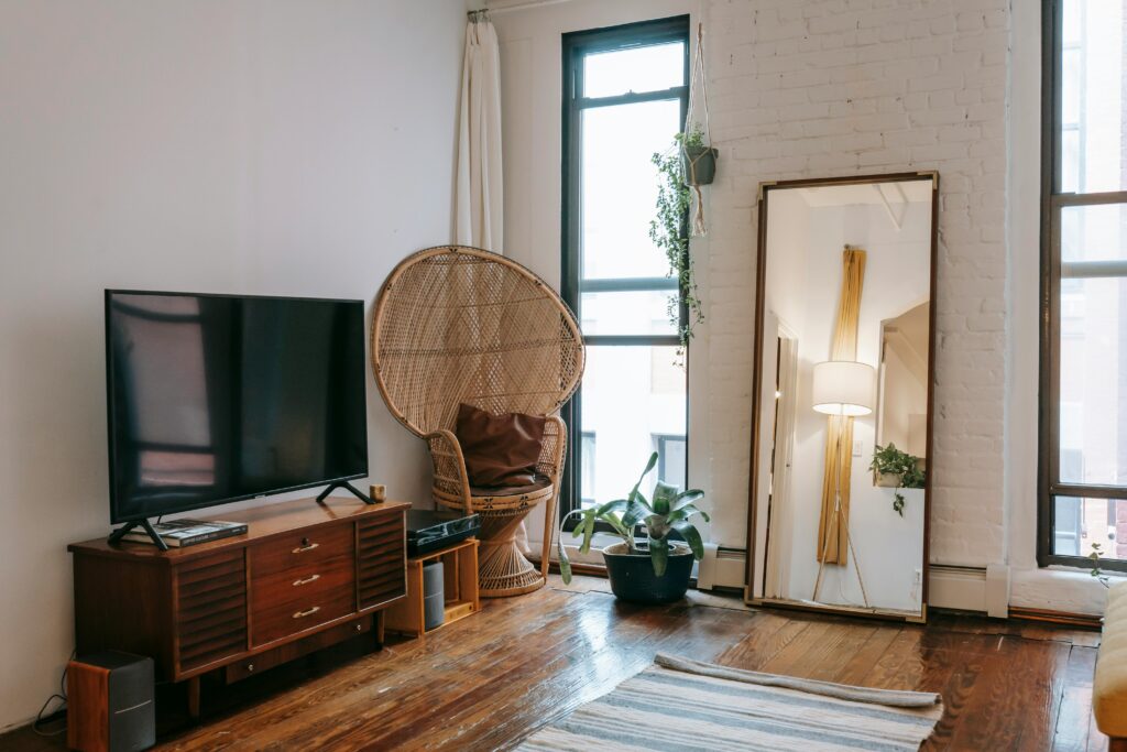 A calm, clutter-free living room with white walls and a cozy chair for minimal living. A calm, clutter-free living room with white walls and a cozy chair.
