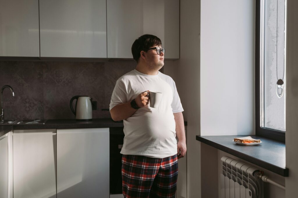 Person enjoying a cup of coffee peacefully Person enjoying a cup of coffee peacefully