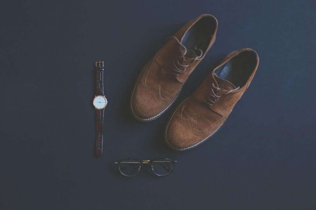 Leather shoes and leather watch complementing each other Leather shoes and leather watch complementing each other