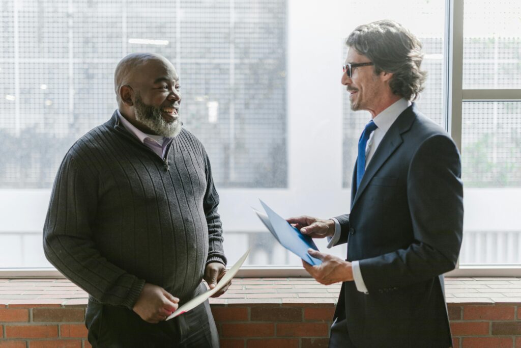 The Power Of Saying No Someone smiling confidently while having a calm conversation—showing self-assured communication.