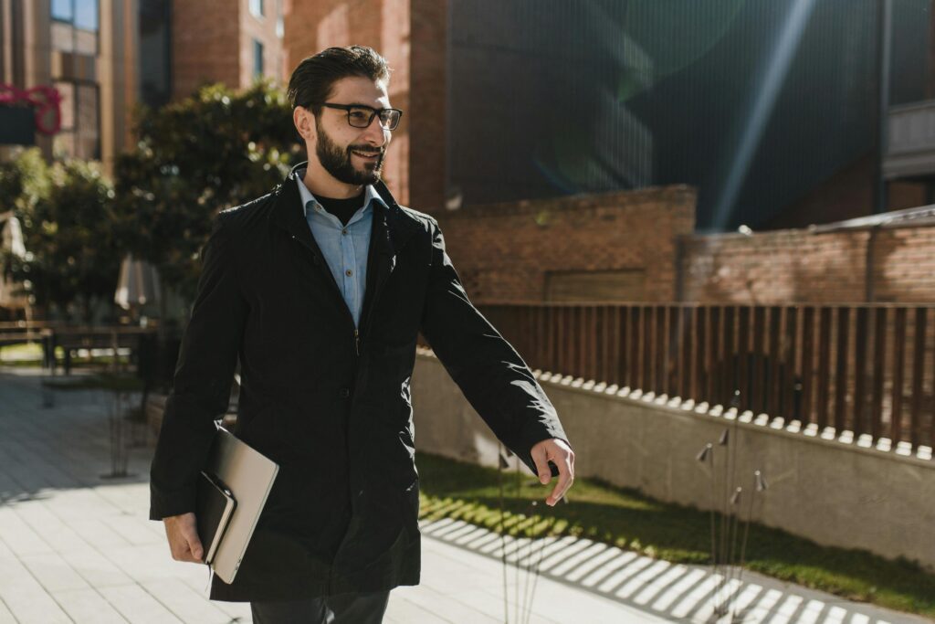 A confident man walking forward taking action instead of overthinking decisions