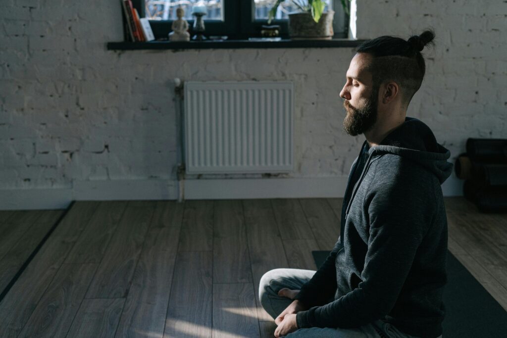 Man practicing mindful awareness breathing to calm overthinking thoughts