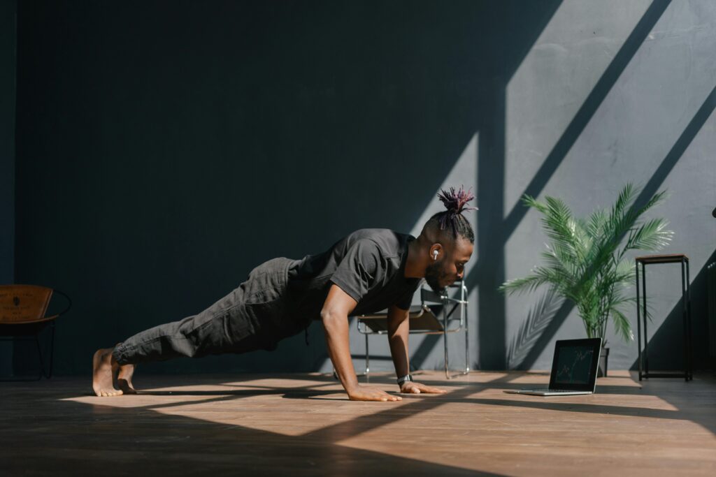 Man doing simple bodyweight exercises at home applying the 2-minute rule to build self-discipline