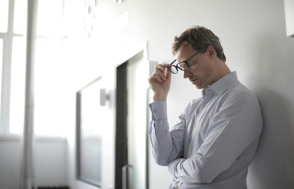 Man challenging negative thoughts and questioning overthinking patterns to make better decisions