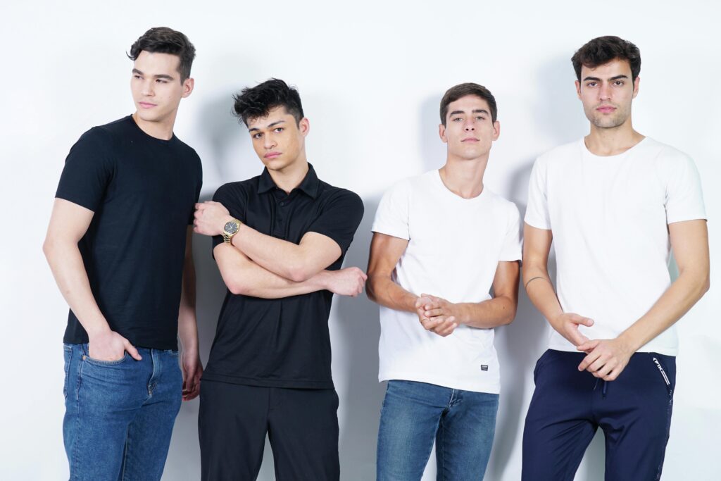 Budget Fashion to look stylish Men's neutral colour palette showing black, white, navy, olive, and grey as the foundation for a budget-stylish wardrobe