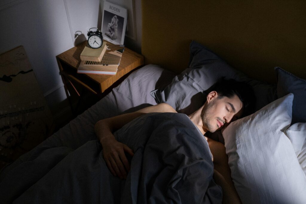 Man getting quality deep sleep as the most important first step in burnout recovery